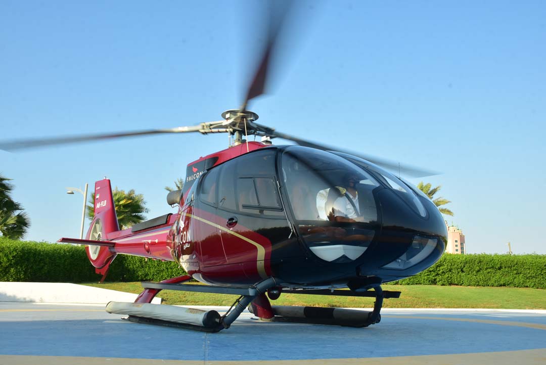 EC 130 with rotors turning before departure